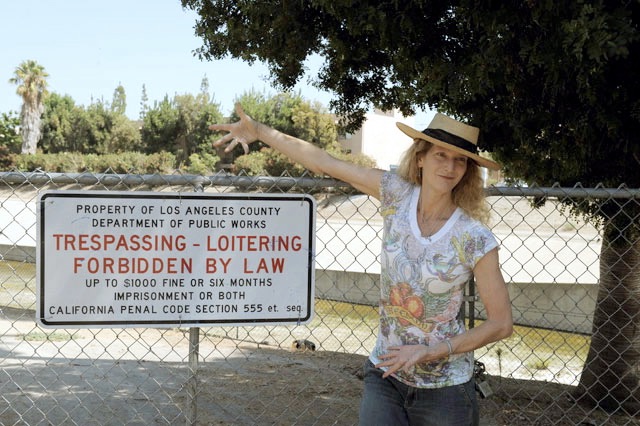 1-mELANIE-WITH-SIGN.jpg